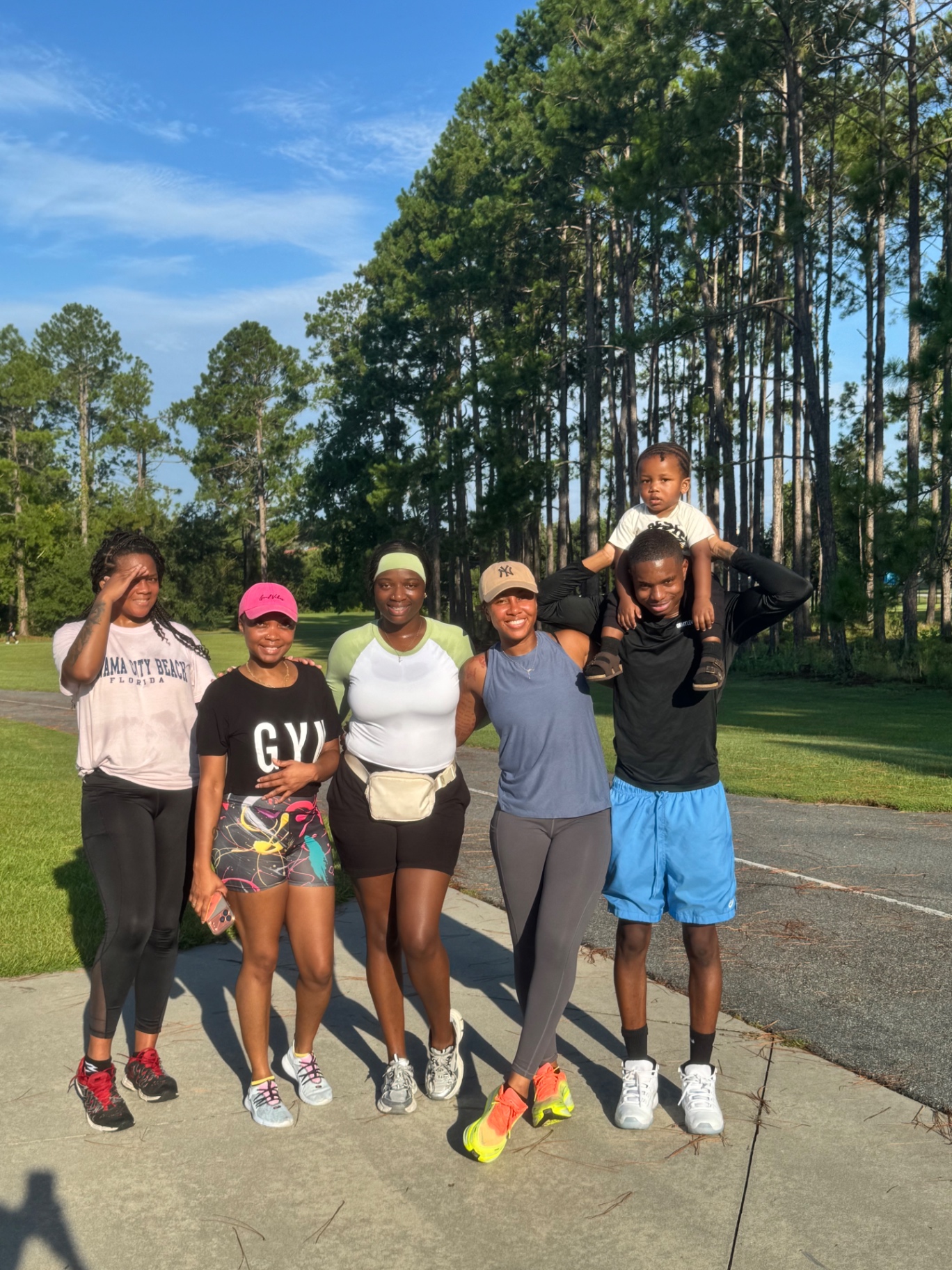 Run club families gathered and smiling after a morning run